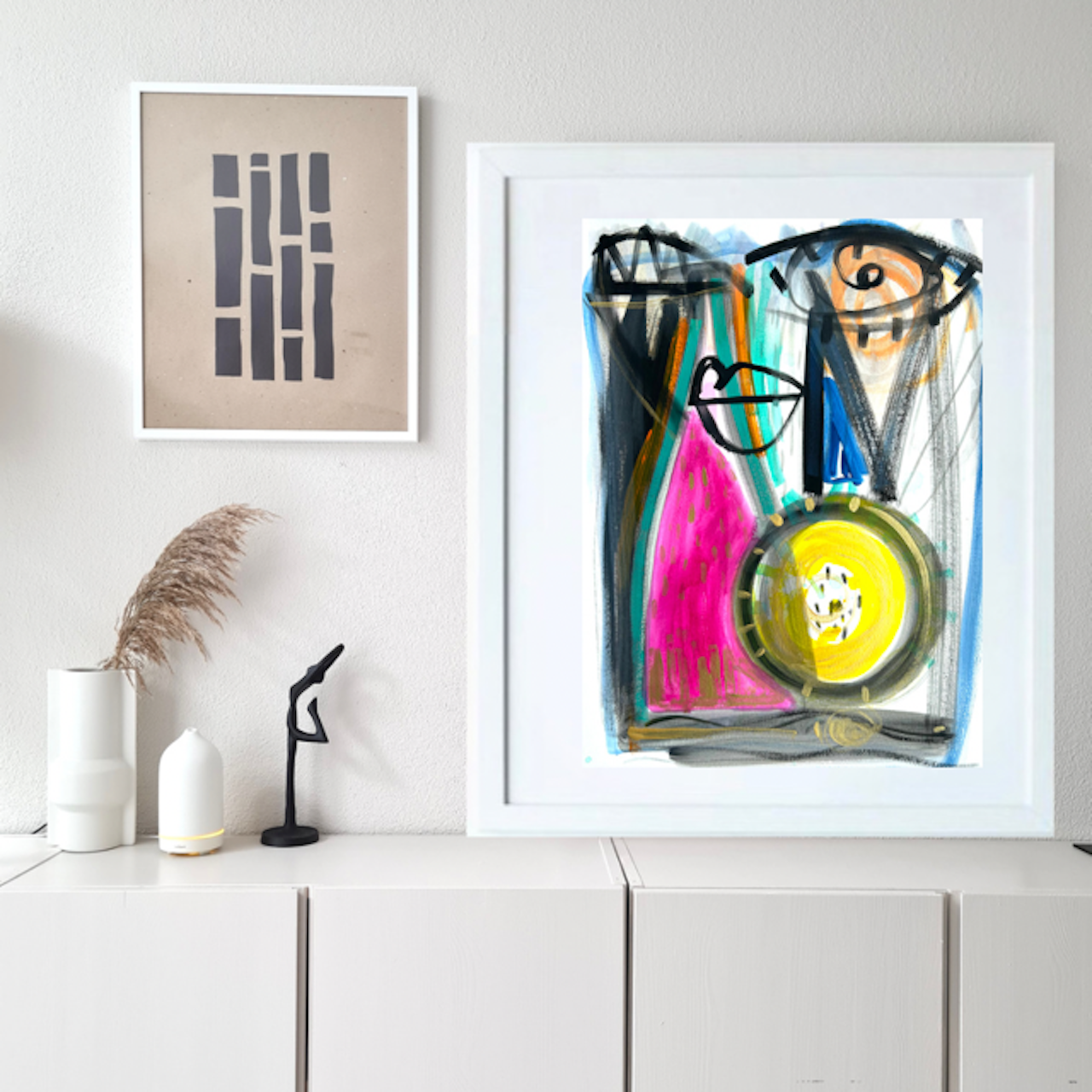 Framed abstract artwork on a wall with minimal decor