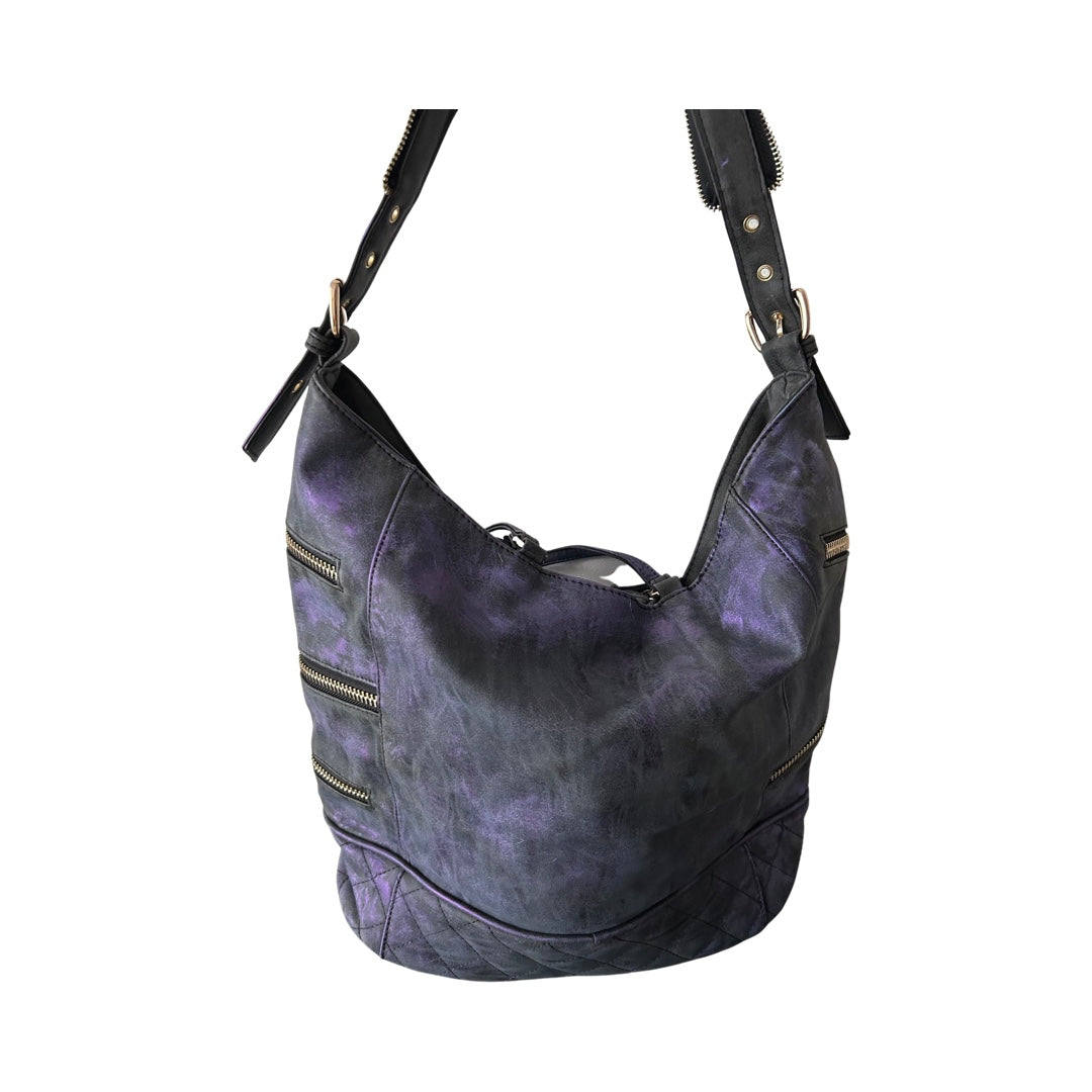 Purple leather handbag with gold accents on a white background
