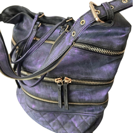 Purple leather bag with gold zippers on a white background