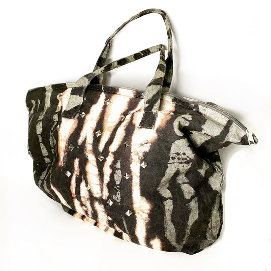 Tote bag with zebra print pattern on a white background