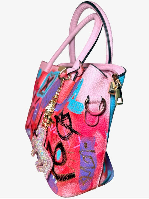 Colorful handbag with artistic design and decorative elements on a white background