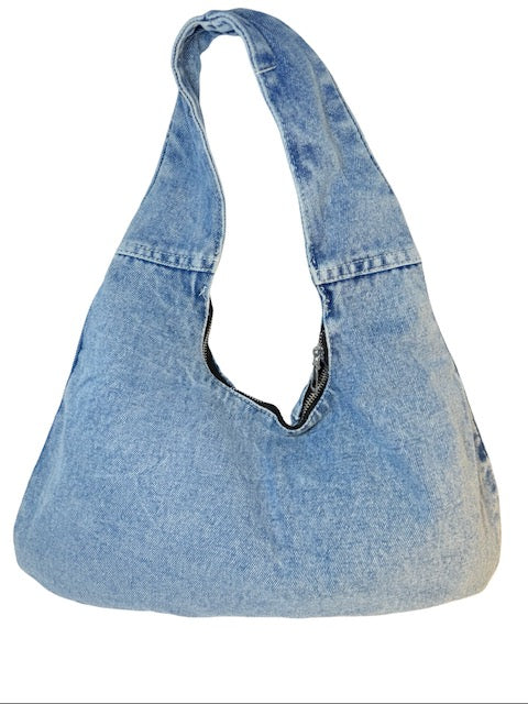 Blue denim handbag on a white background