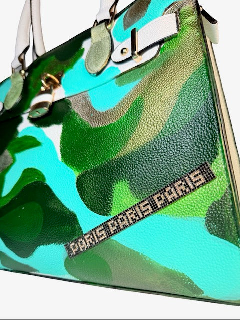 Camouflage-patterned handbag with 'Paris Paris' branding on a white background