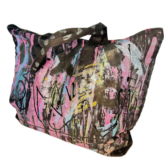 Colorful abstract-patterned bag on a light background