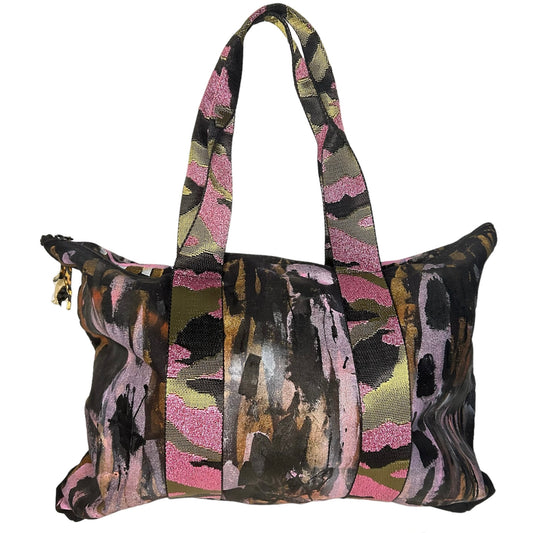 Multicolored patterned bag with a strap on a white background