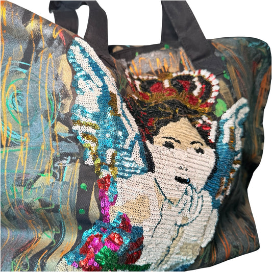 Tote bag with embroidered design of a woman wearing a crown and holding flowers on a colorful background.