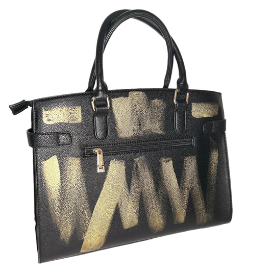 Black handbag with gold abstract design on a white background