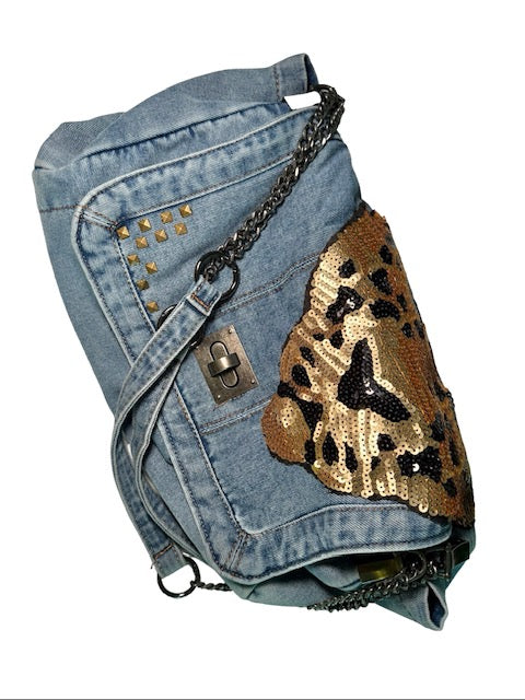 Denim jacket with gold sequin butterfly design on a white background