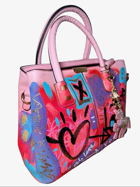 Colorful handbag with artistic design on a white background