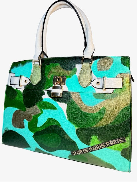 Camouflage-patterned handbag with 'PARIS PARIS PARIS' branding on a white background