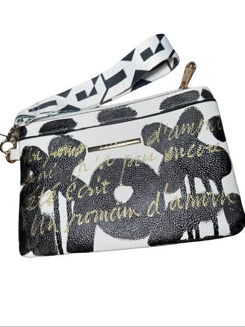 Black and white floral patterned pouch with gold text on a white background