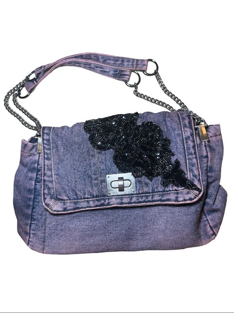 Denim handbag with a black dog design on a white background