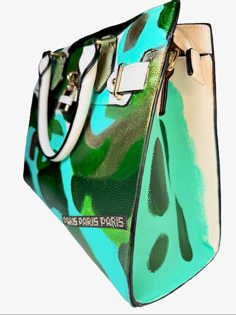 Holographic green and blue handbag with 'PARIS PARIS' branding on a white background