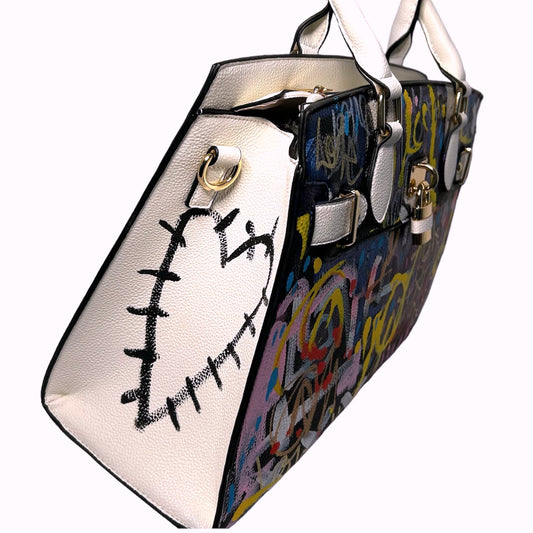 Handbag with artistic design on a white background