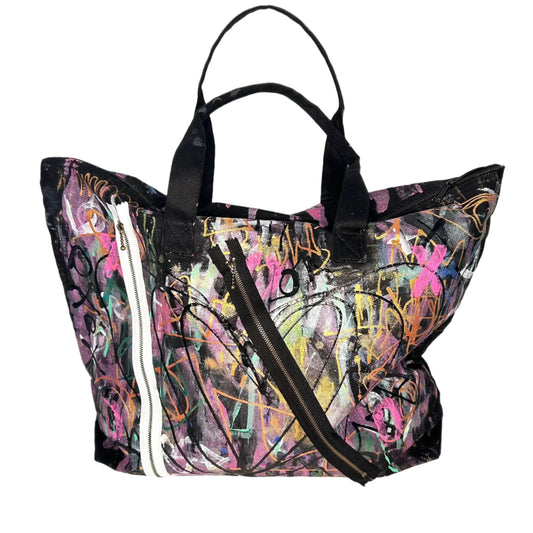 Colorful tote bag with abstract design on a white surface