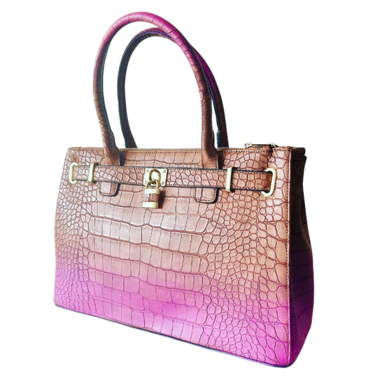 Handbag with pink to purple gradient and crocodile texture on a light background