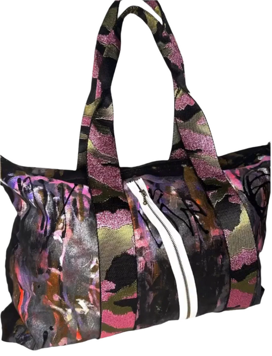 Multicolored patterned bag with a white stripe on a white background